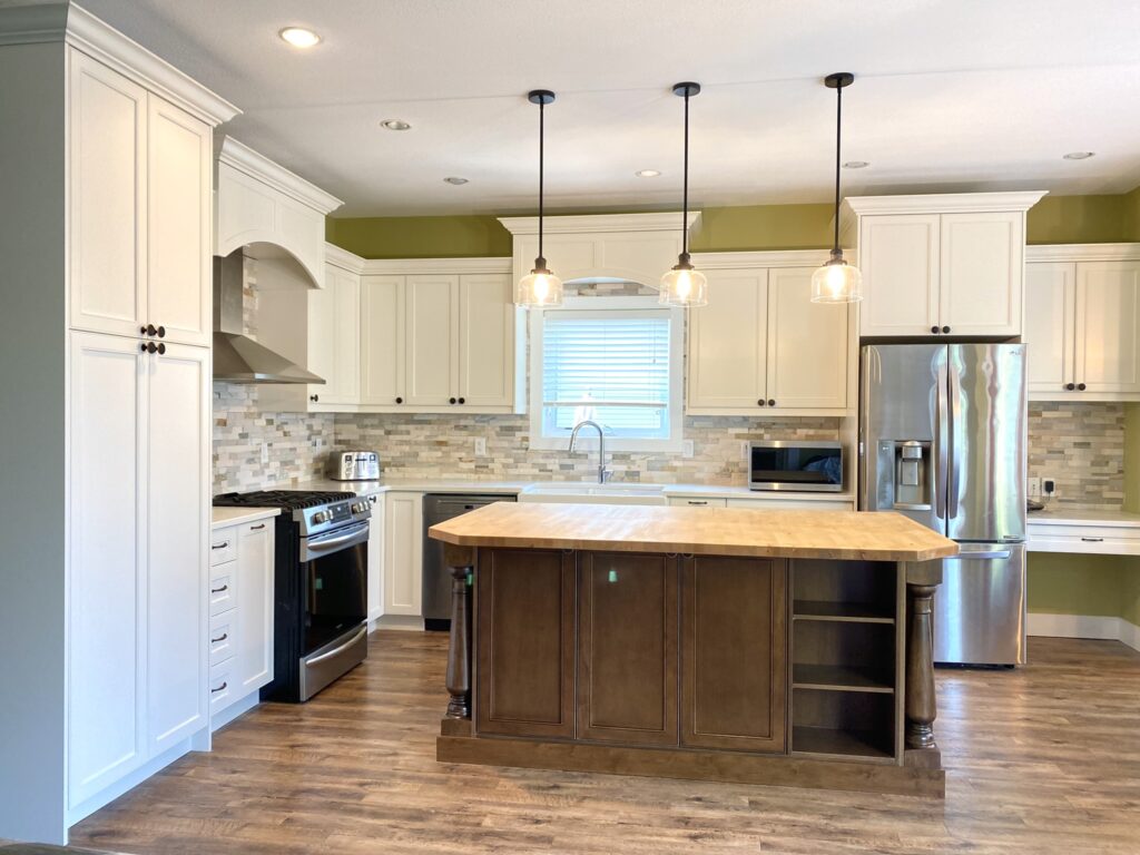 Modern kitchen with island and appliances.